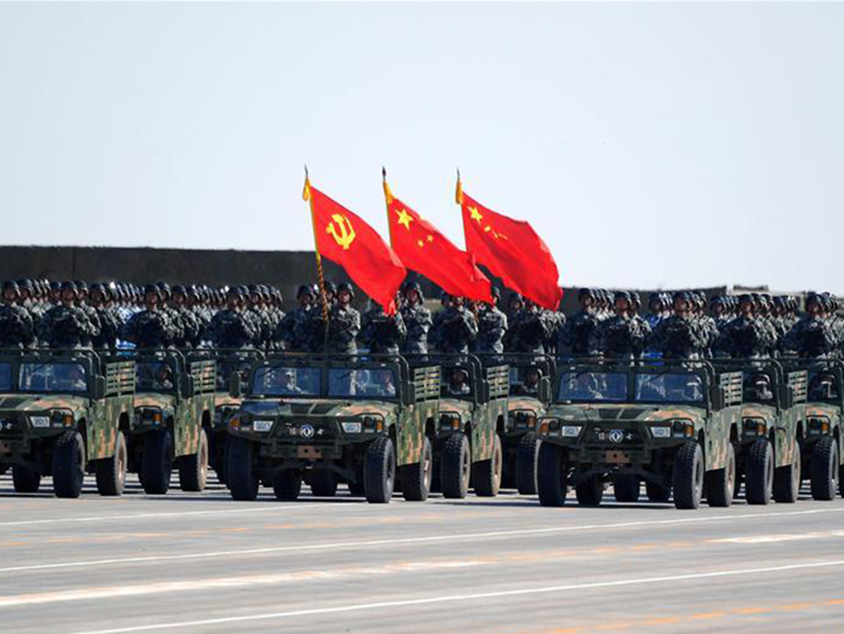 A flag guard formation consisting of officers and soldiers from the army  air force  navy and rocket force of the chinese people s liberation army  pla  attends a military parade to mark the 90th anniversary of the founding of th
