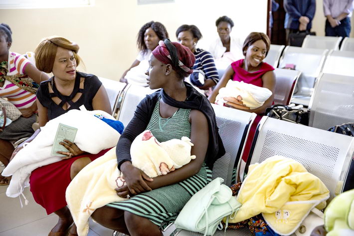 Zambian women wait for doctors’ calling for reexamination outside of the Department of Gynecology and Obstetrics, the busiest department of the China-Zambia Friendship Hospital.