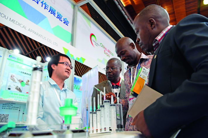 December 13, 2017: A Chinese businessman shows products to visitors at the first Exhibition of the China-Africa Production Capacity Cooperation in Nairobi, Kenya.  Xinhua