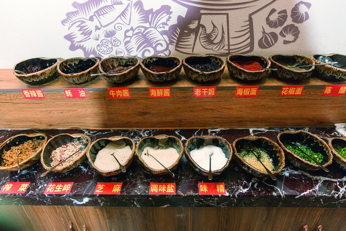 By mixing different seasoning sauces, the customers can create their preferred flavor themselves.  by Qin Bin