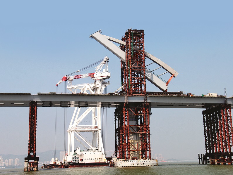 2015: The sail-design tower at Jiuzhou Channel Bridge angled straight above the sea. Because of its proximity to Zhuhai city proper and the Macao airport, buildings were limited to a height of 122 meters, so the “sail” stands at 120 meters. courtesy of HZMB Authority